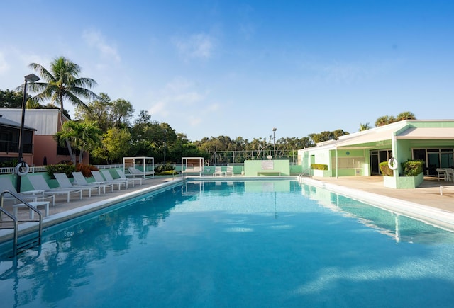 view of swimming pool with a patio