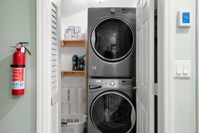 washroom with stacked washer and dryer