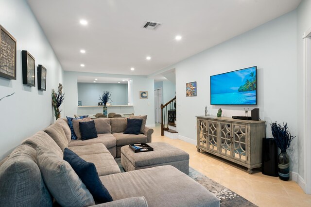 living room with light tile patterned floors