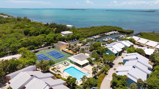 birds eye view of property with a water view