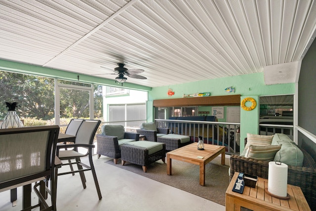 sunroom featuring ceiling fan