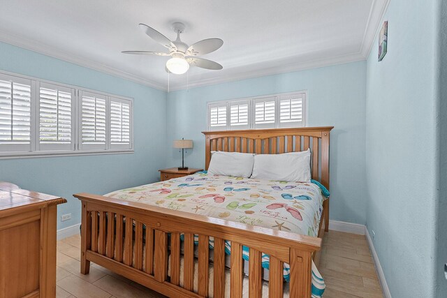 bedroom with multiple windows, ornamental molding, and ceiling fan