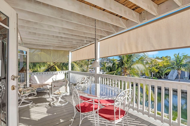 wooden deck with a water view