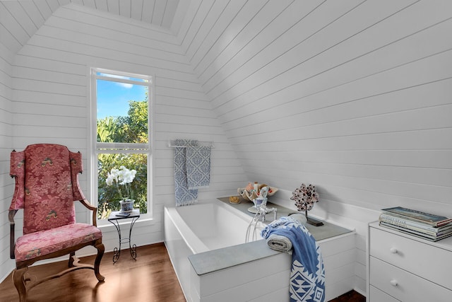 sitting room with wood-type flooring