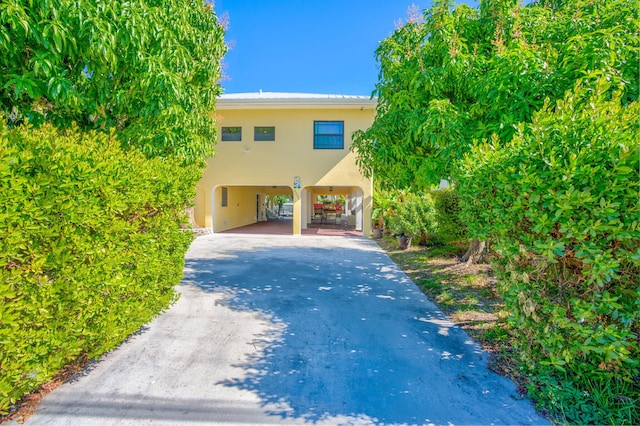 view of front of home featuring a carport