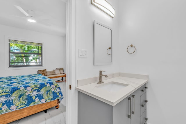 bathroom with ceiling fan and vanity