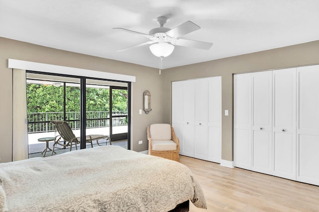 bedroom featuring multiple closets, ceiling fan, access to outside, and light wood-type flooring