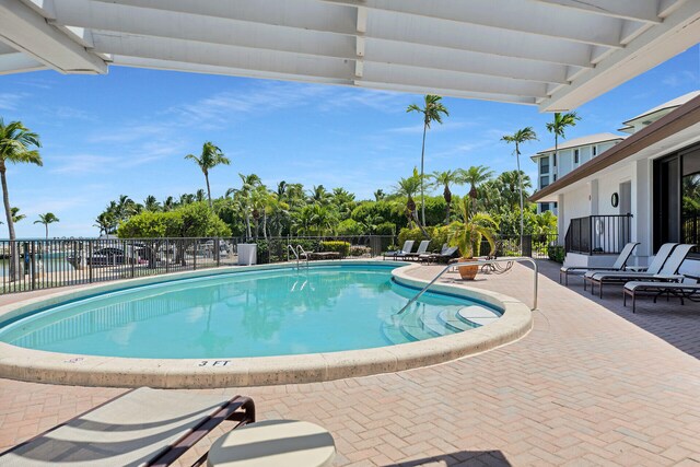 view of swimming pool featuring a patio area