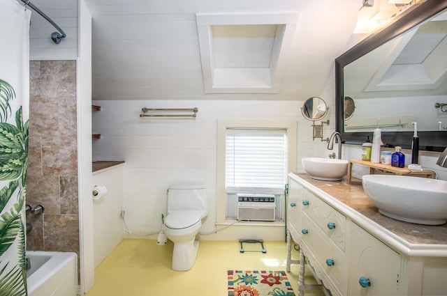 full bathroom featuring vanity, a wall mounted AC, toilet, and shower / bath combo with shower curtain