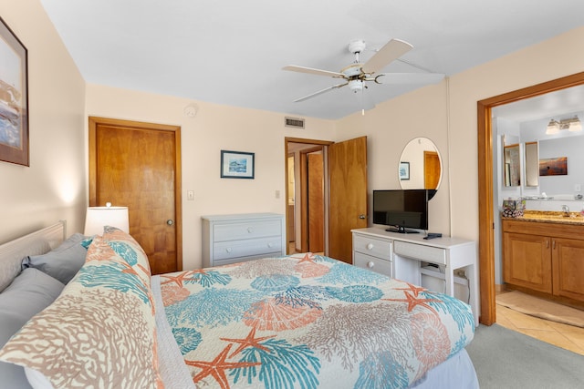 1133 W Ocean Dr Unit 2, Key Colony, FL 33051 - bedroom with light colored carpet, a sink, connected bathroom, ceiling fan, and visible vents