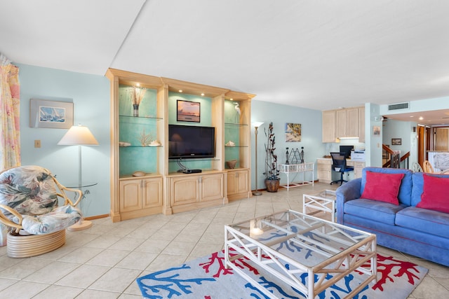 1133 W Ocean Dr Unit 2, Key Colony, FL 33051 - living room featuring light tile patterned flooring, baseboards, visible vents, and stairway
