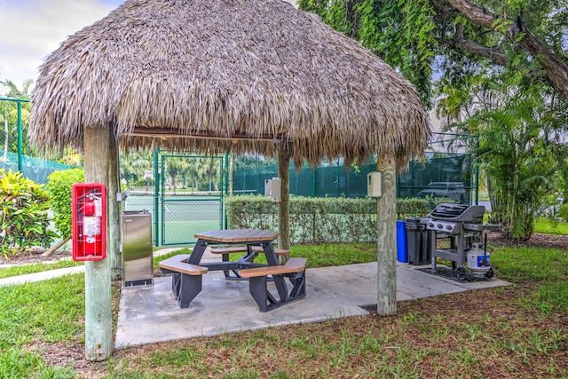 1133 W Ocean Dr Unit 2, Key Colony, FL 33051 - view of patio with fence, a gate, a gazebo, area for grilling, and a tennis court