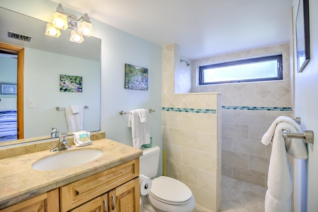 1133 W Ocean Dr Unit 2, Key Colony, FL 33051 - full bathroom with visible vents, toilet, a walk in shower, and vanity