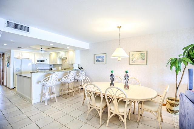 dining space with a ceiling fan, light tile patterned flooring, visible vents, and recessed lighting