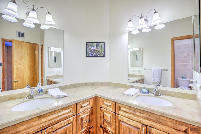 1133 W Ocean Dr Unit 2, Key Colony, FL 33051 - full bathroom with toilet, a sink, double vanity, and visible vents