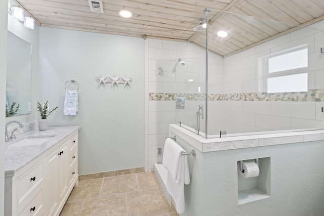 bathroom featuring a shower with shower door, lofted ceiling, tile patterned flooring, vanity, and wooden ceiling