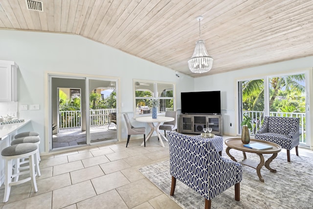 sunroom / solarium featuring a chandelier, vaulted ceiling, and wooden ceiling