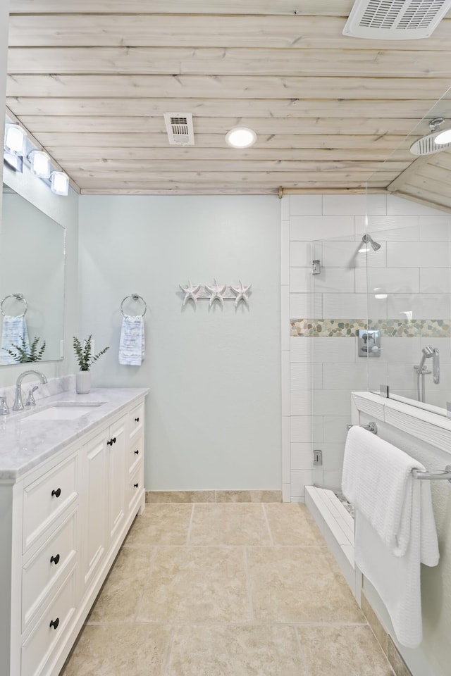 bathroom with a shower with door, vanity, and wooden ceiling