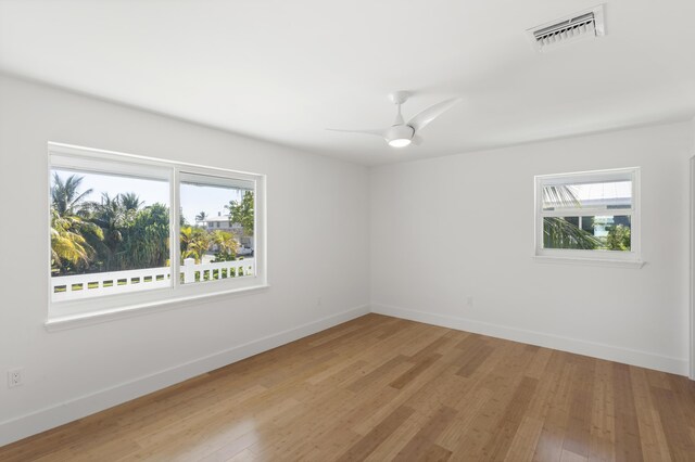 spare room featuring ceiling fan and light wood-type flooring