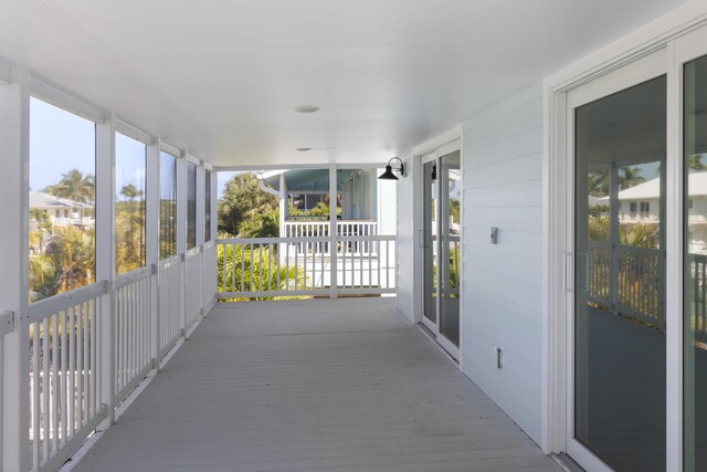 unfurnished sunroom with plenty of natural light