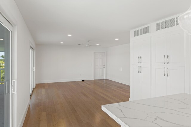 unfurnished room featuring wood-type flooring