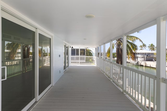 wooden deck with a water view