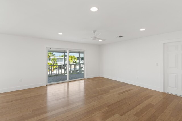 unfurnished room with ceiling fan and light hardwood / wood-style floors