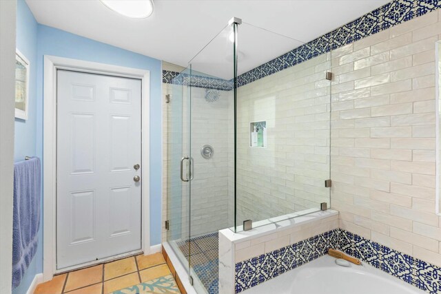 bathroom featuring independent shower and bath and tile patterned floors