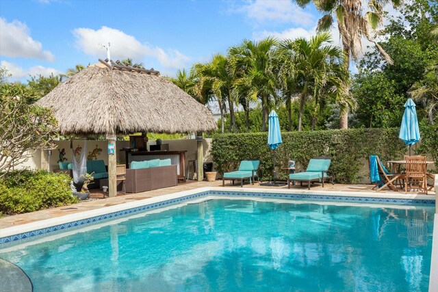 view of pool with a patio and an outdoor hangout area