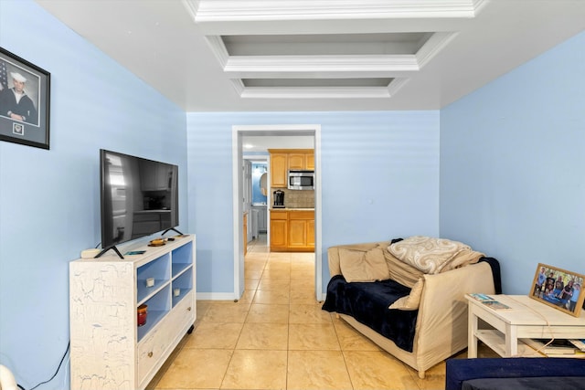 sitting room with crown molding, a raised ceiling, and light tile patterned floors