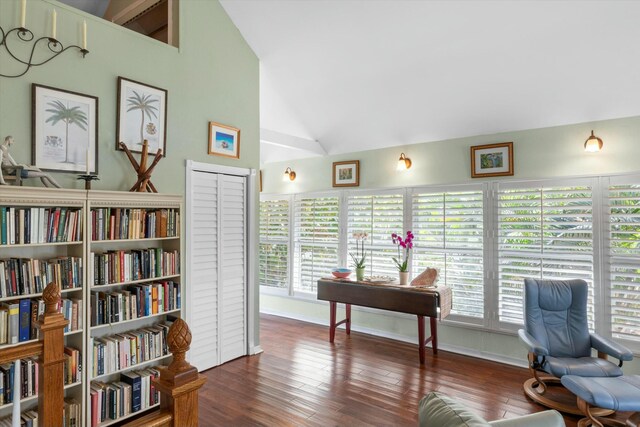 office area with dark wood-type flooring and high vaulted ceiling