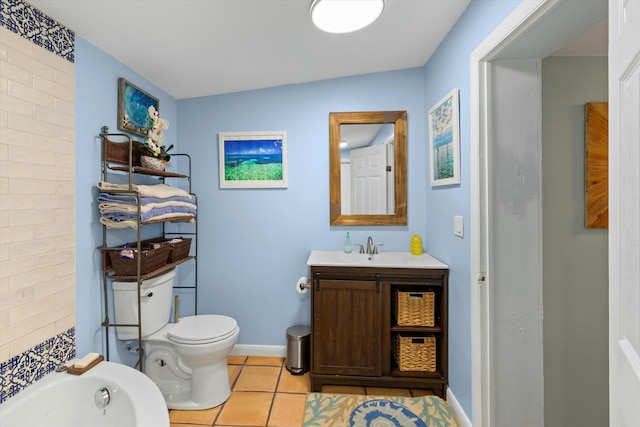 bathroom featuring vanity, toilet, tile patterned flooring, and a bathtub