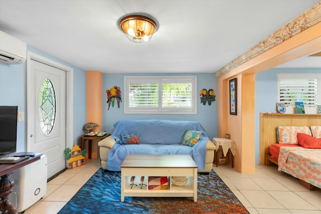 living room featuring a wall mounted air conditioner and light tile patterned floors