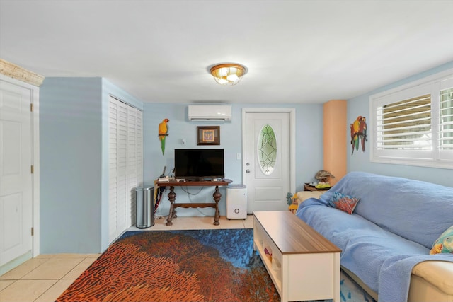 living room with light tile patterned floors and a wall unit AC