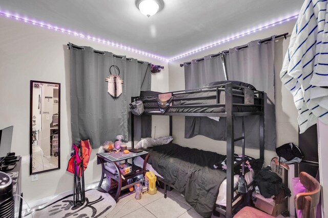 bedroom featuring light tile patterned floors