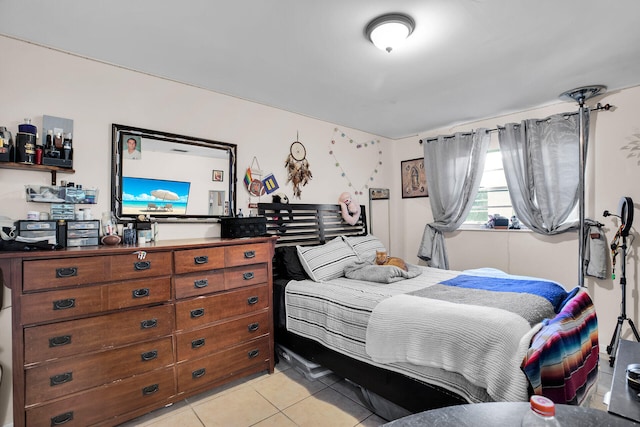 bedroom featuring light tile patterned flooring