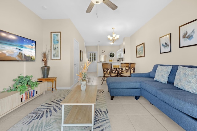 tiled living room featuring ceiling fan with notable chandelier