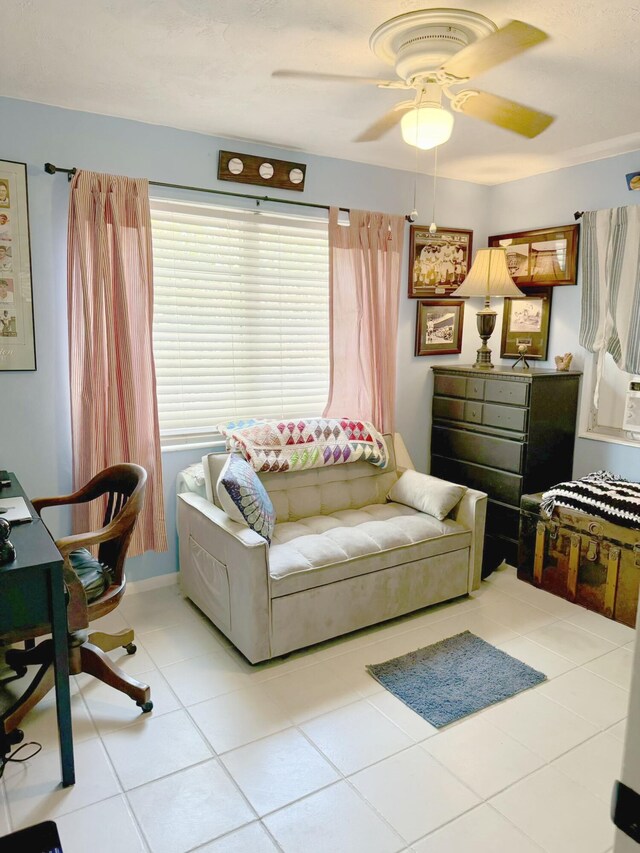 tiled living room featuring ceiling fan