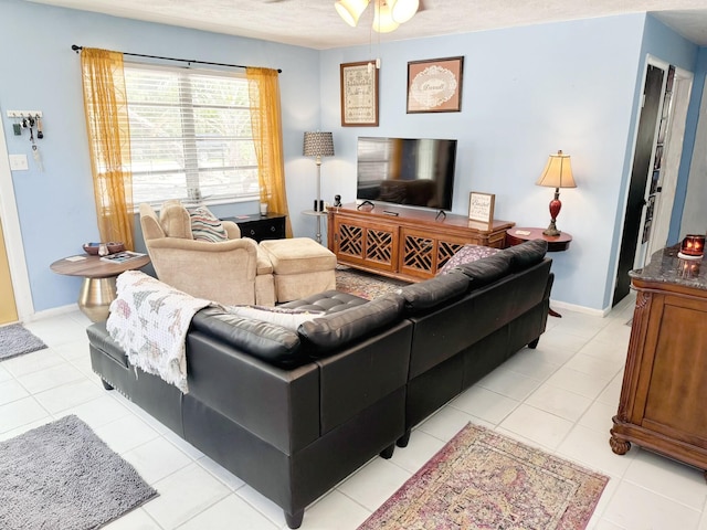 tiled living room featuring ceiling fan