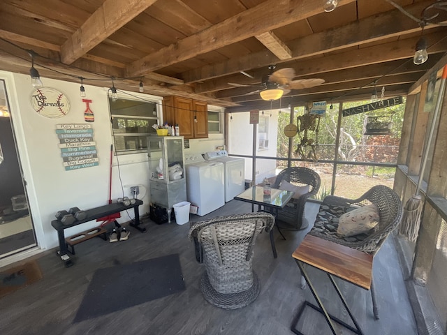 sunroom featuring beam ceiling, washer and dryer, and wooden ceiling