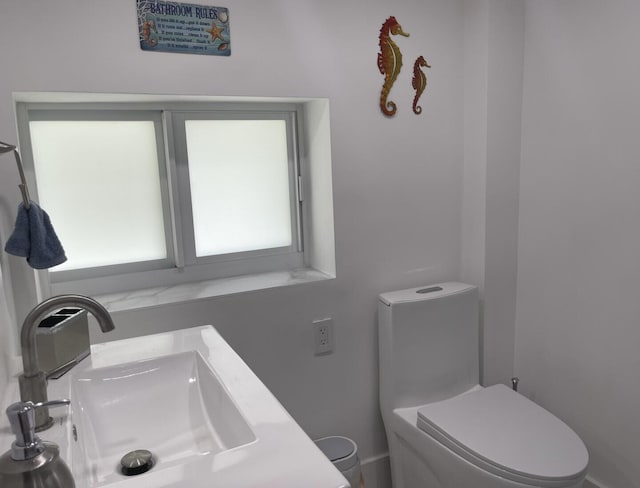 bathroom featuring sink and toilet