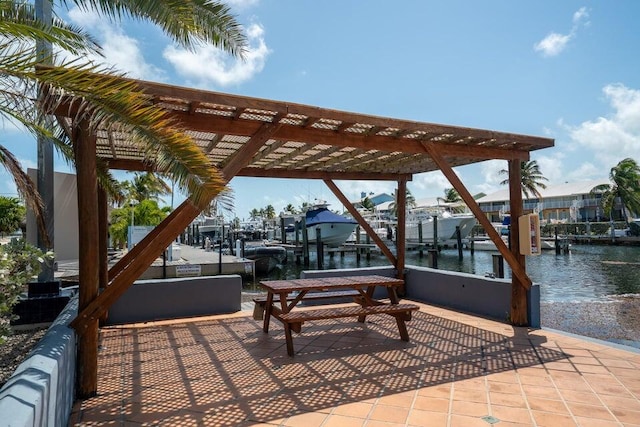 1500 Ocean Bay Dr Unit H12, Key Largo, FL 33037 - view of patio featuring boat lift, a dock, and a water view