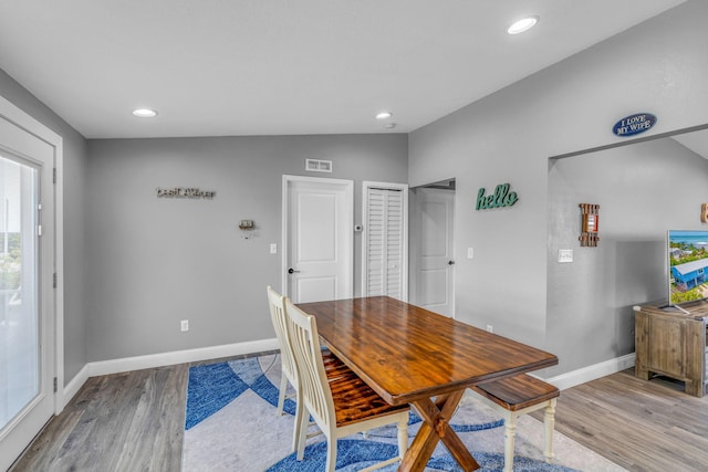 25081 Overseas Hwy, Summerland, FL 33042 - dining room featuring wood finished floors, baseboards, recessed lighting, and vaulted ceiling