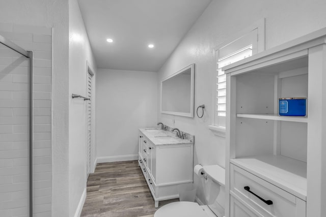 25081 Overseas Hwy, Summerland, FL 33042 - full bathroom with vanity, wood finished floors, toilet, recessed lighting, and a textured wall