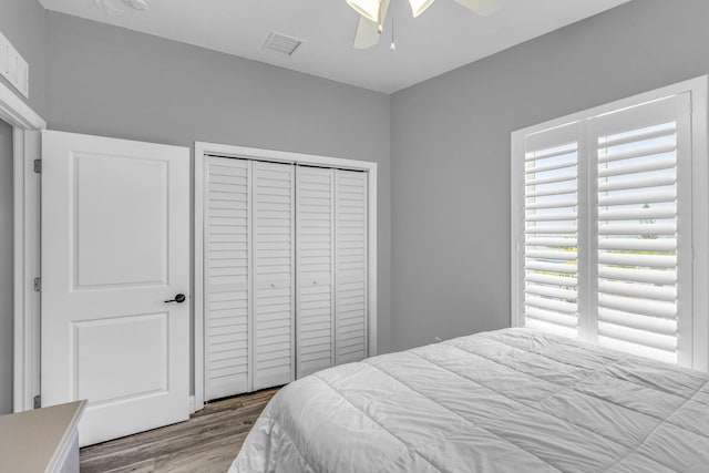 25081 Overseas Hwy, Summerland, FL 33042 - bedroom with wood finished floors, multiple windows, a closet, and a ceiling fan
