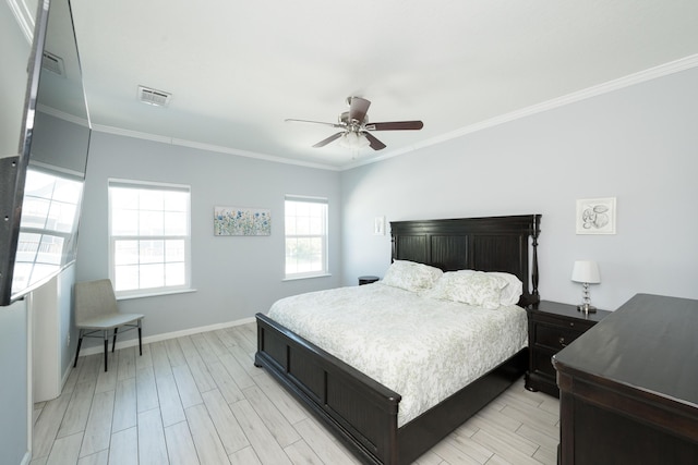 bedroom with wood tiled floor, visible vents, crown molding, and baseboards