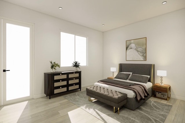 bedroom with light hardwood / wood-style floors