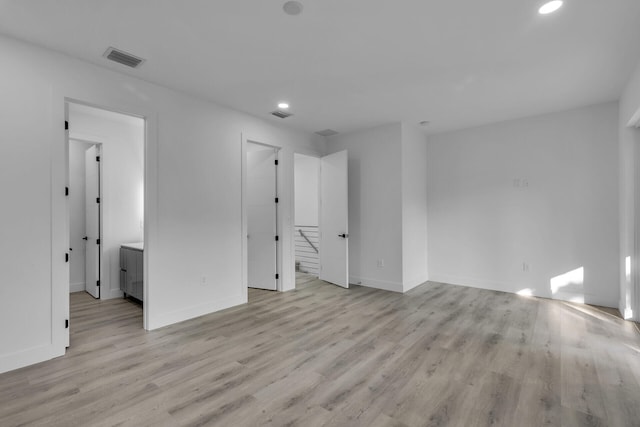 unfurnished room with light hardwood / wood-style flooring