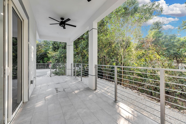 view of patio / terrace featuring a balcony and ceiling fan