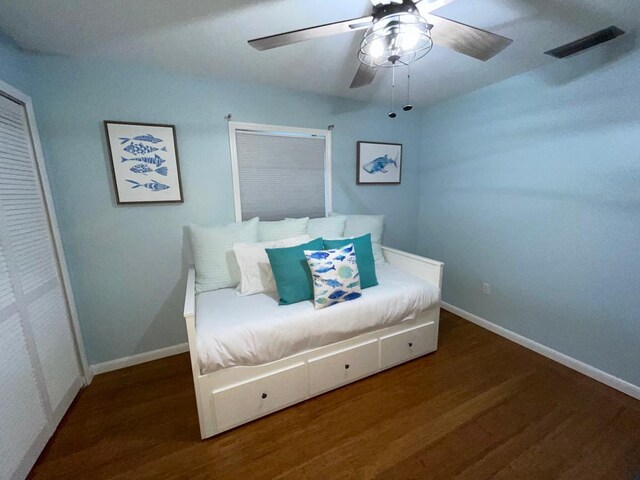 bedroom featuring ceiling fan and dark hardwood / wood-style flooring